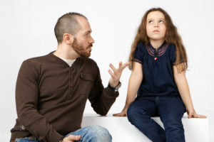 Father having serious conversation with his daughter