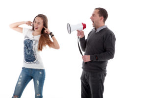 father shouting at daughter with mega phone